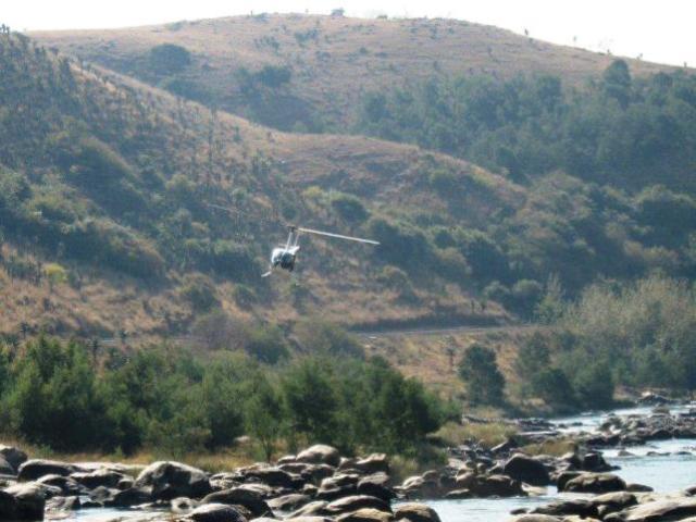 Helicopter over river