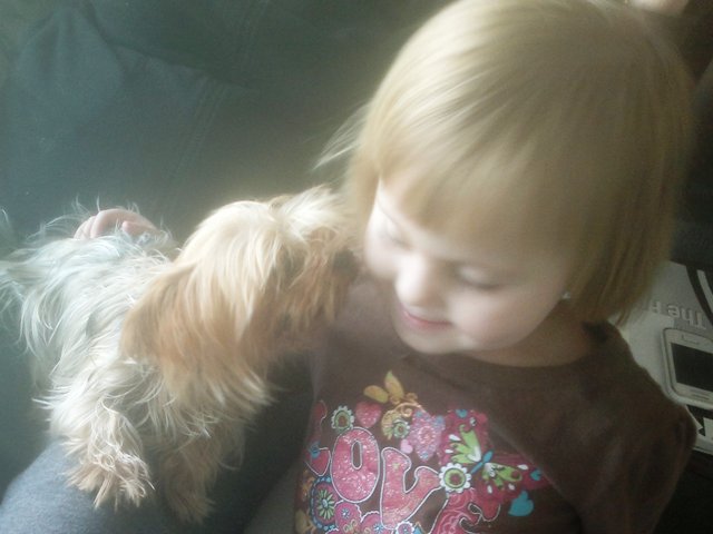 No doubt at all is that this kiss Is quite a hit with little Miss!