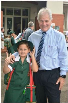 J was given the honour of posing with the principal of her school on her first day back.